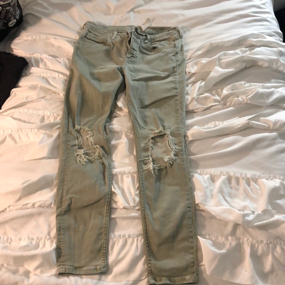 Ripped green jeans